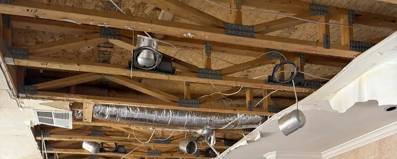 Kitchen ceiling opened up after a roof leak — Fast Track Restoration job photo