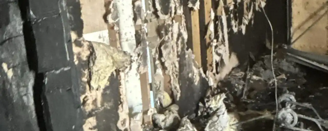 Charred wall framing after a house fire — Fast Track Restoration job photo