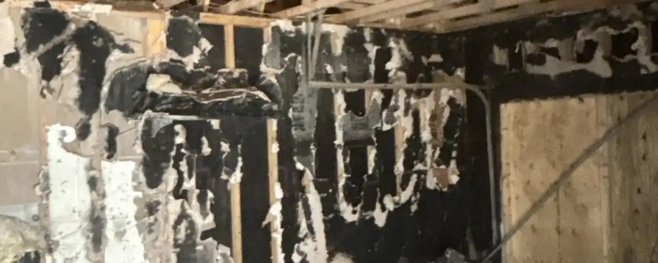 Charred attic framing after a house fire — Fast Track Restoration job photo